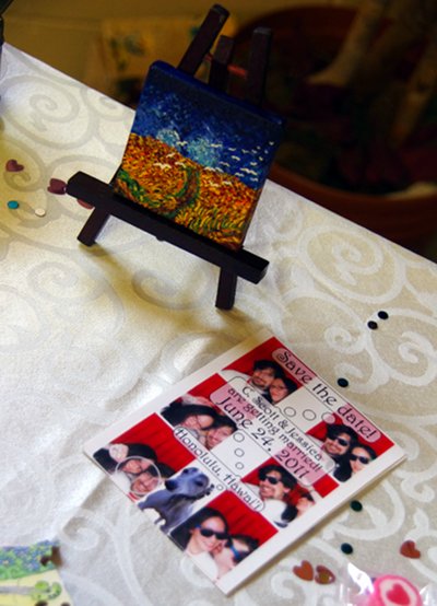 Scott's painting, next to a save-the-date card
